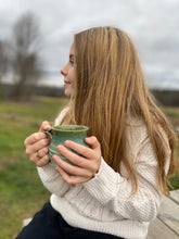 Load image into Gallery viewer, Teannager holding a Handmade Ceramic Tea Mug